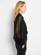 Black chiffon cardigan. Sheer sleeves, fitted cuffs.  Slightly cropped.