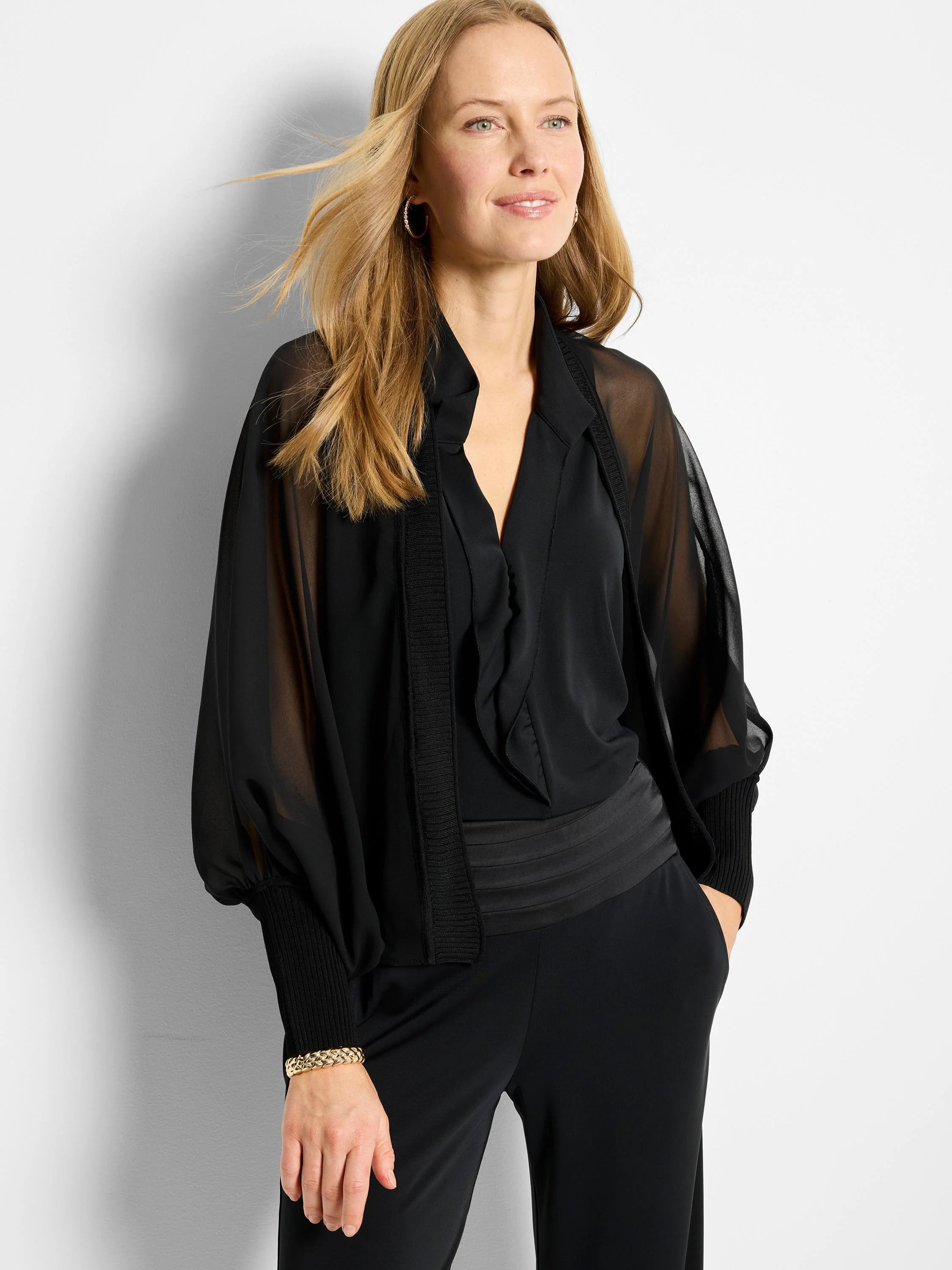 Black chiffon cardigan; sheer sleeves, ribbed cuffs, V-neck.  Solid black underlayer.