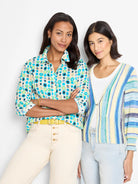 Striped cardigan in pale yellow, blue, and green hues.  Open front.