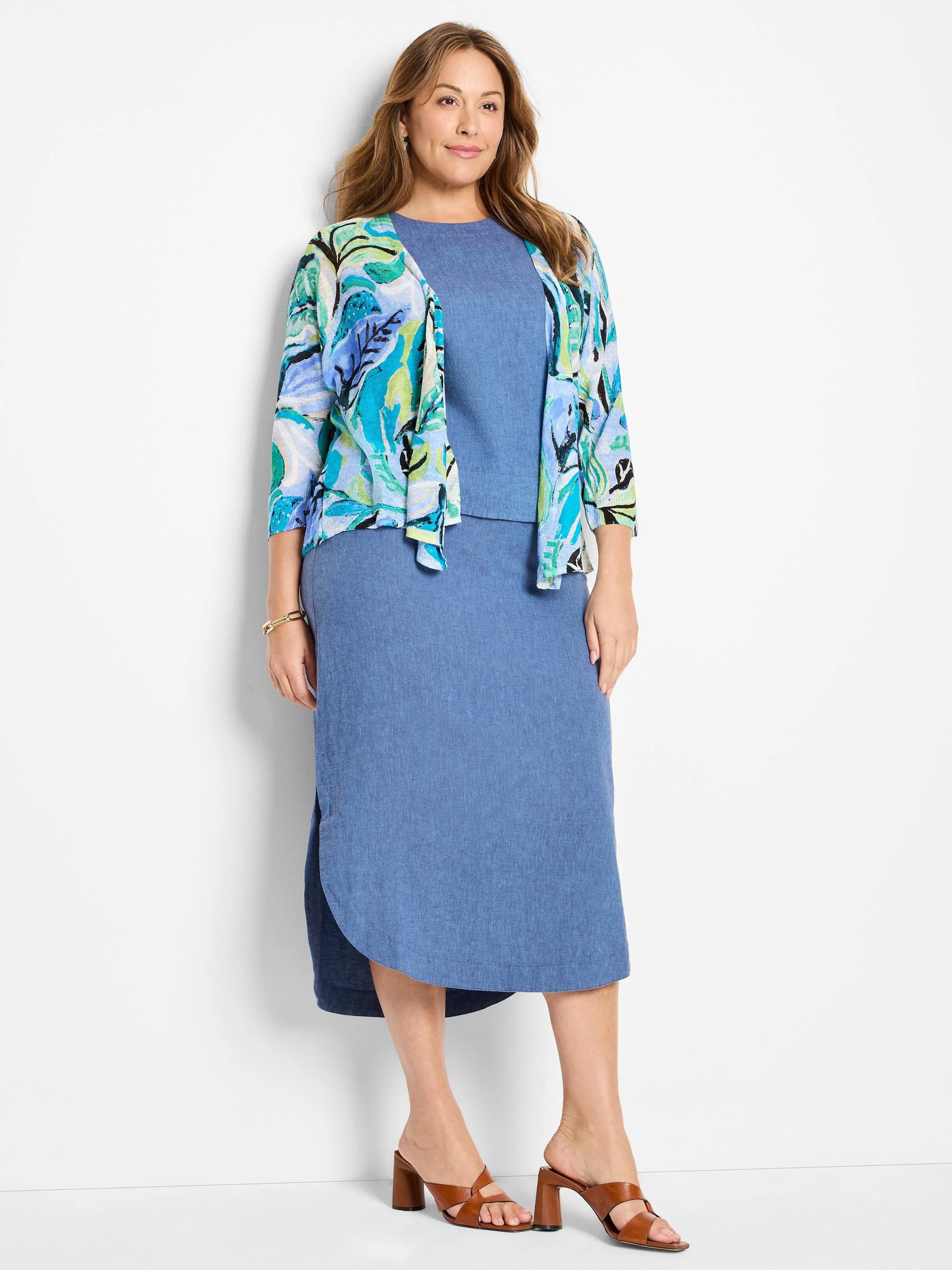 Blue denim skirt & teal, green, & white floral print 3/4 sleeve cardigan.