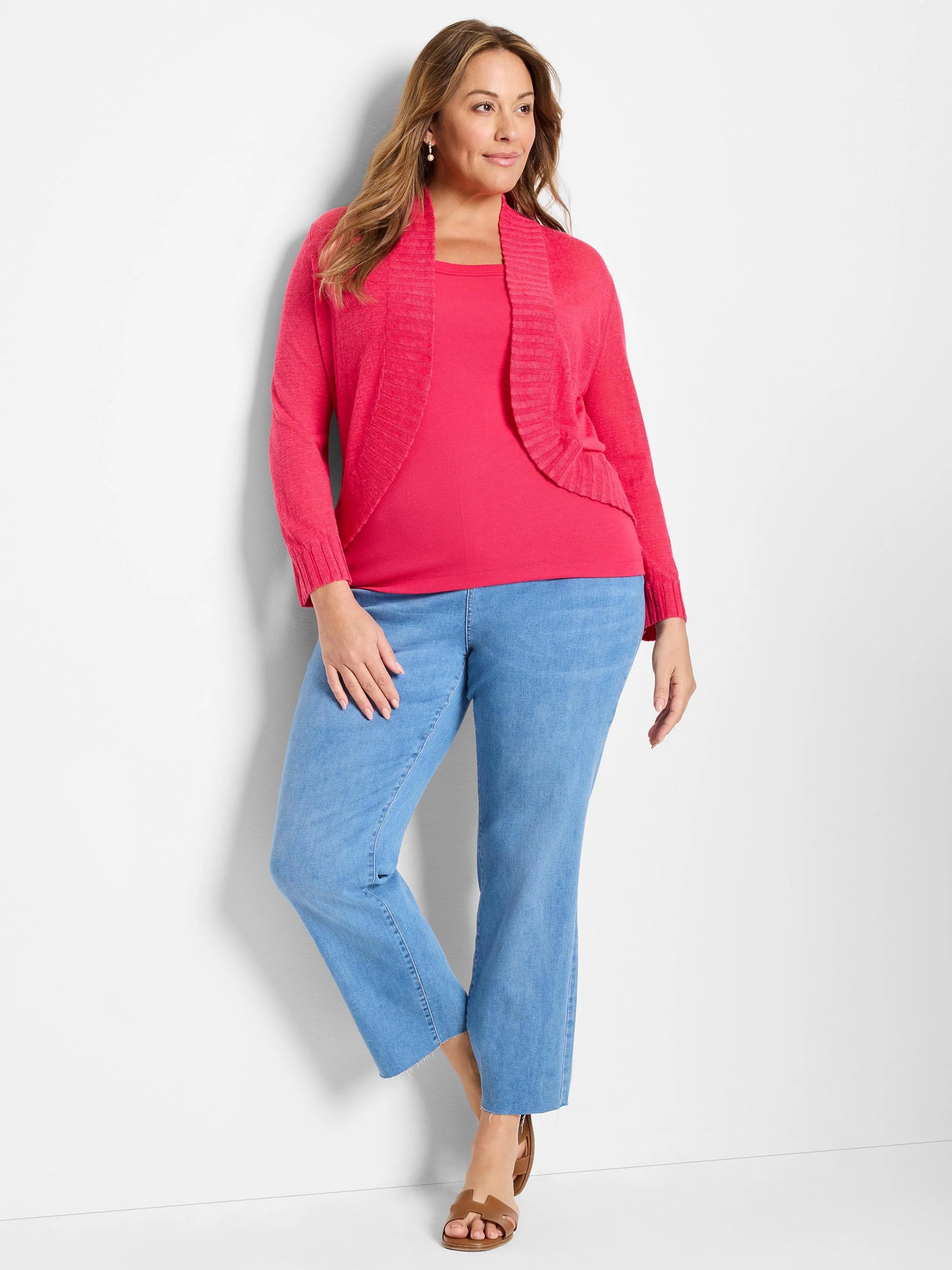 Fuchsia knit bolero cardigan, open front with a ribbed collar.