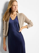 Beige, open-knit cocoon cardigan with 3/4 cuffed sleeves.