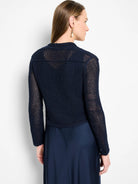 Navy open-knit mesh cardigan with long sleeves, worn by model.