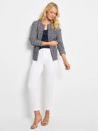 Navy and off-white chevron weave knit jacket, collarless with a front zip.