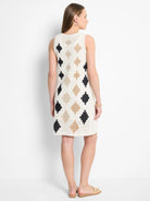 Cream crochet sleeveless dress. Black and beige diamond pattern.