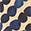 Dark indigo blue spots on a light beige background.  Slightly mottled texture.  Low contrast.