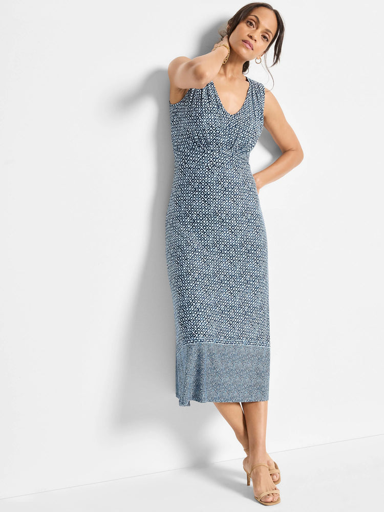 Sleeveless midi dress in blue and white geometric print.  Lower hem features a slightly different pattern.