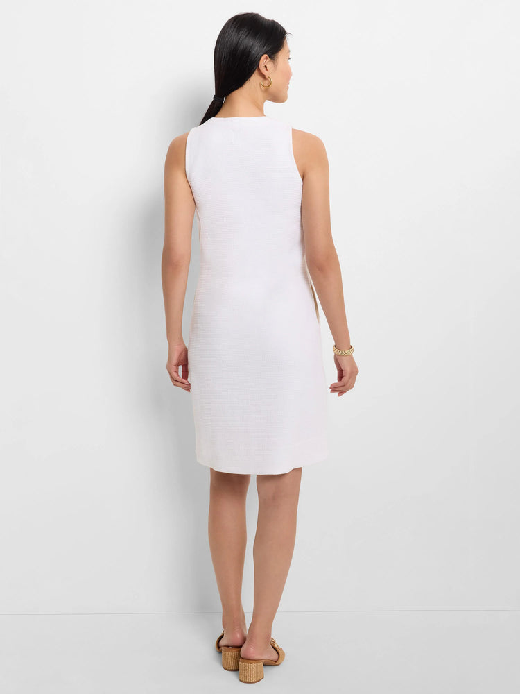 White, sleeveless, textured cotton dress;  A-line silhouette, above-knee length.
