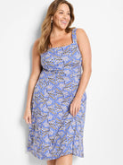 Blue dress with a beige and black geometric print. Sleeveless, square neck, A-line midi length.