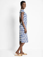 Knee-length dress, blue and off-white crescent moon pattern, short sleeves, boat neck.