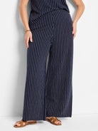 Wide-leg pants; navy blue with thin white pinstripes.