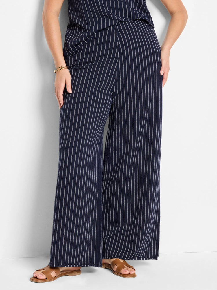 Wide-leg pants; navy blue with thin white pinstripes.