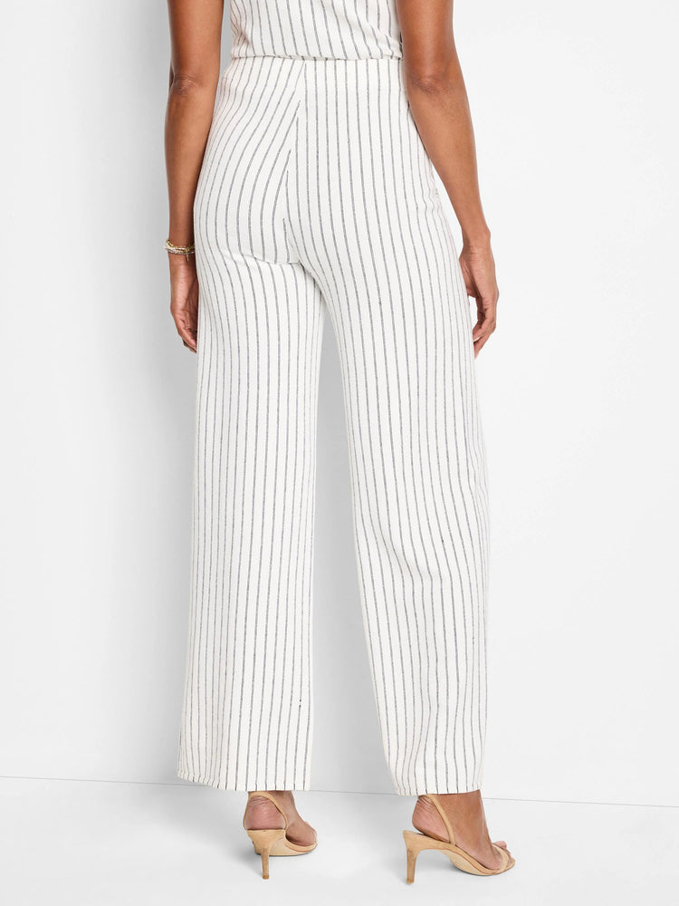 Image of wide-leg pants; off-white with thin, dark-blue vertical stripes.  Rear view.