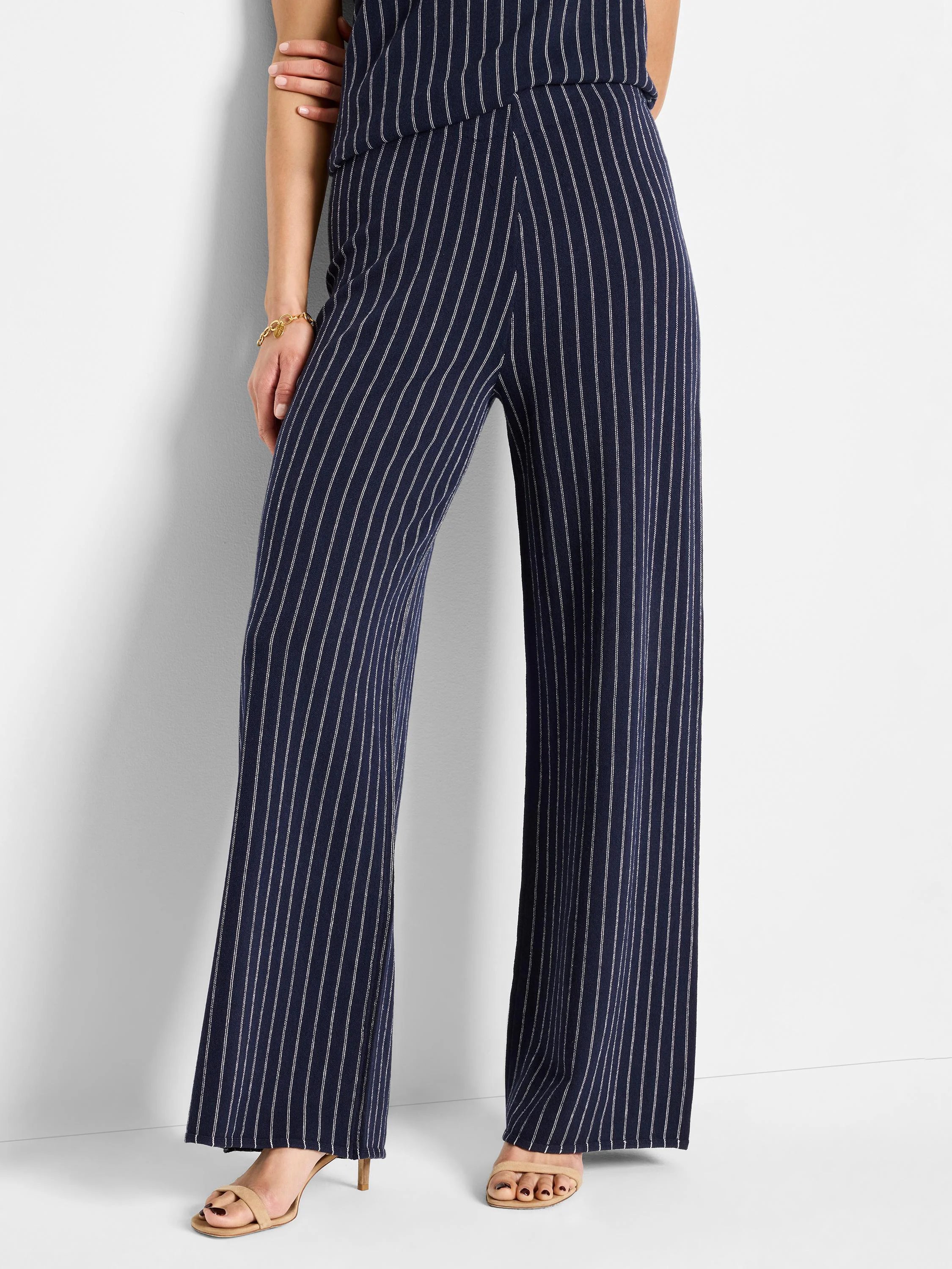 Navy blue wide-leg pants with thin white pinstripes.