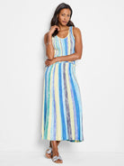 Maxi skirt with vertical stripes in pale yellow, blue, and teal. Knit fabric.