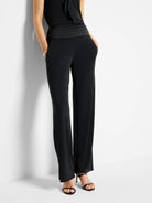 Black wide-leg pants with a pleated cummerbund waistband and pockets.
