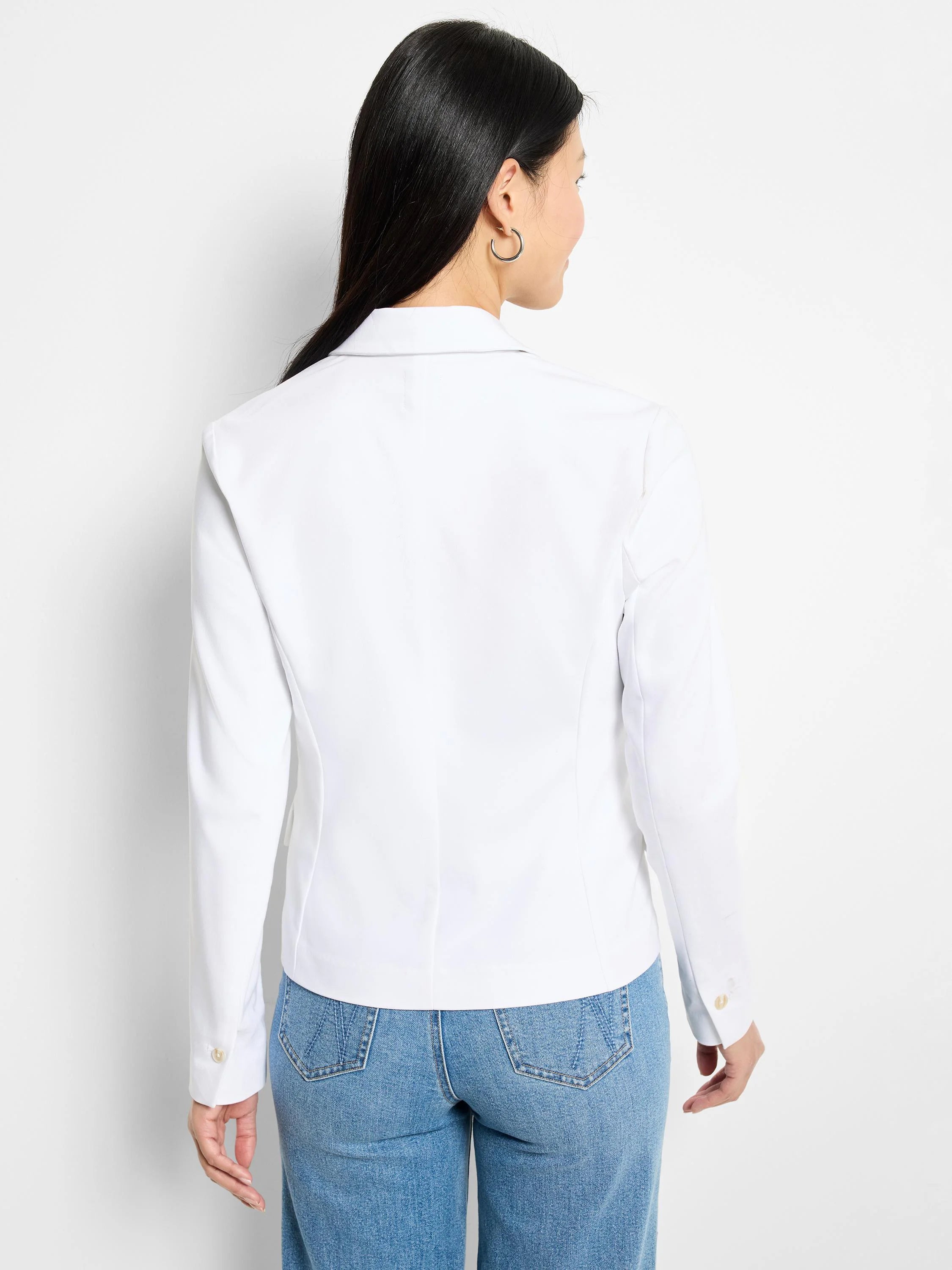 White cotton blazer, long sleeves, button cuffs, shown from the back.