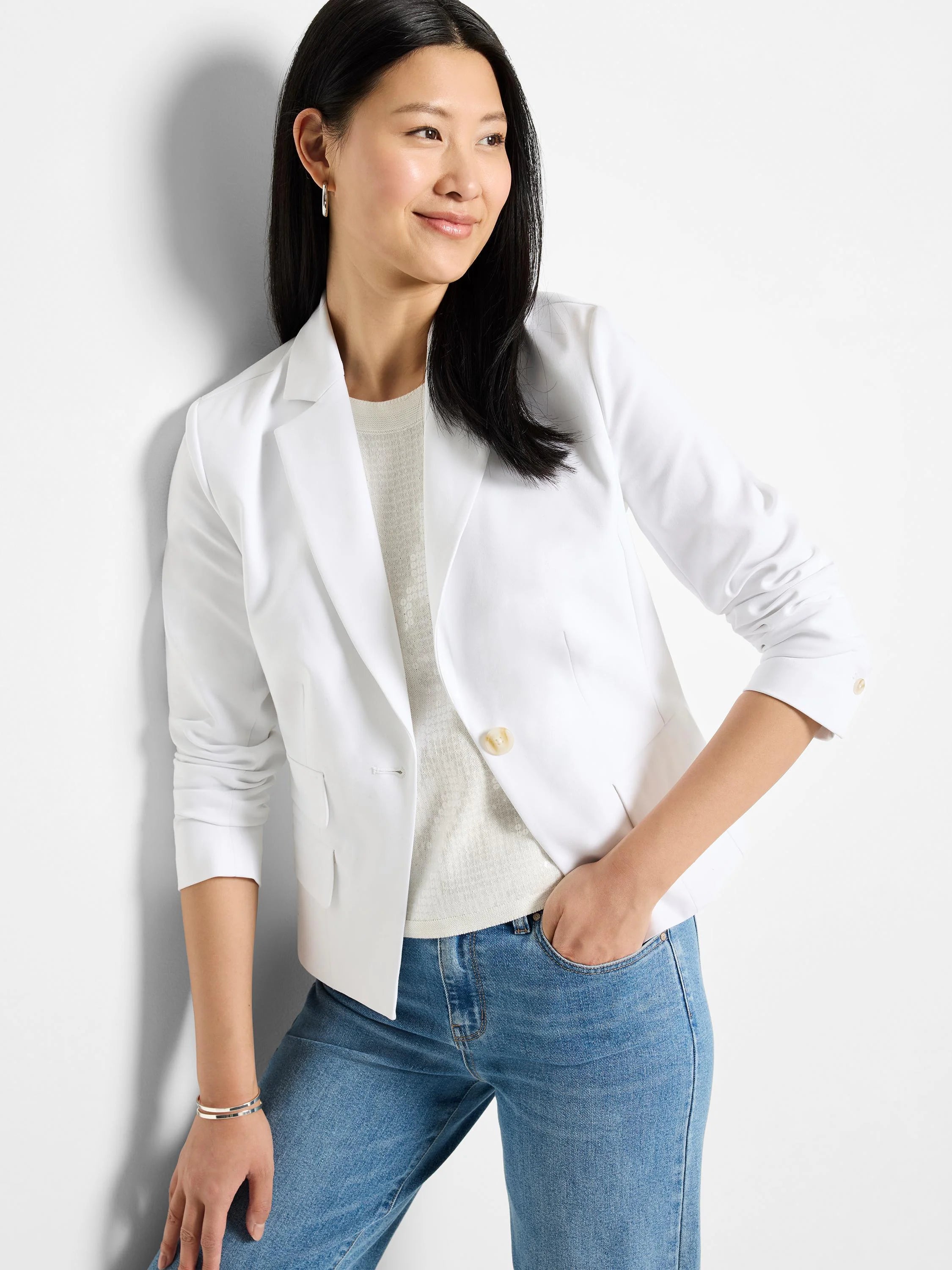 White cotton blazer, single button, two pockets.  Off-white underlayer visible.