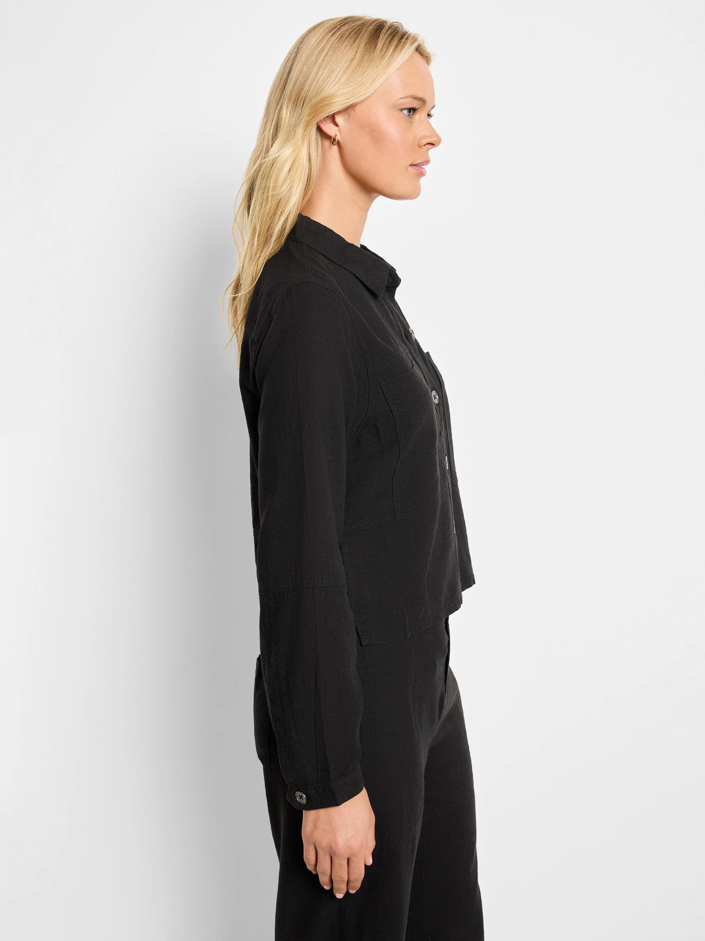 Black linen jacket, collared, long sleeves, button front, and pockets.
