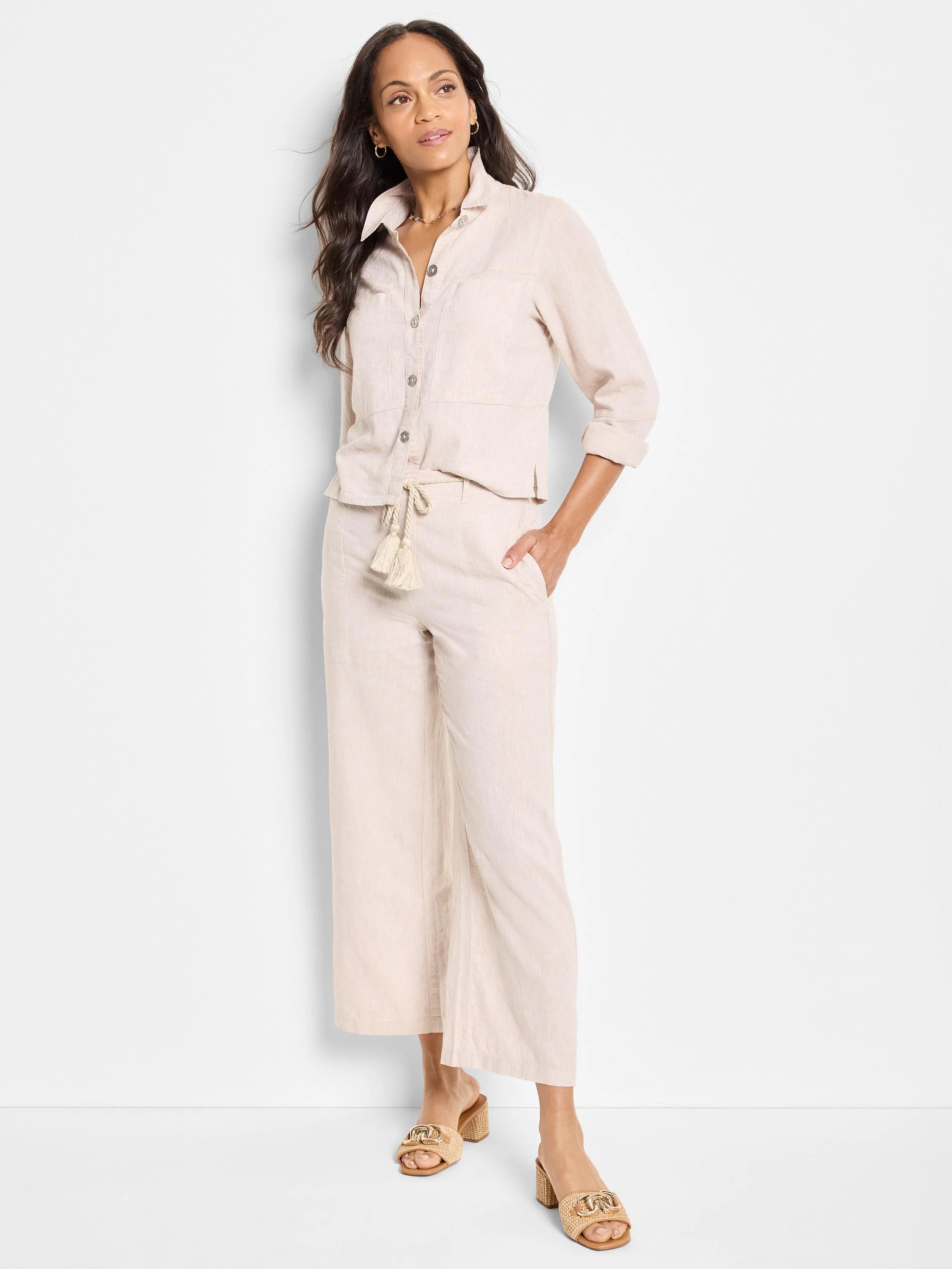 Beige linen jacket and pants;  jacket has pockets and buttons.  Pants have drawstring waist and tassels.