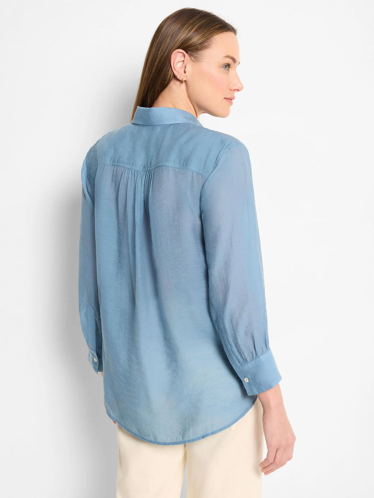 Dusty blue, long-sleeve collared shirt;  slightly sheer fabric;  curved hem.