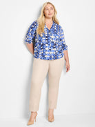 Blue and white shibori print shirt; three-quarter sleeves, collared.