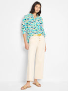 Cotton shirt, off-white background with teal, green, and dark blue scattered circles. Long sleeves.