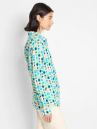 Cotton shirt, off-white background, teal, green, and black circles pattern. Long sleeves, collared.