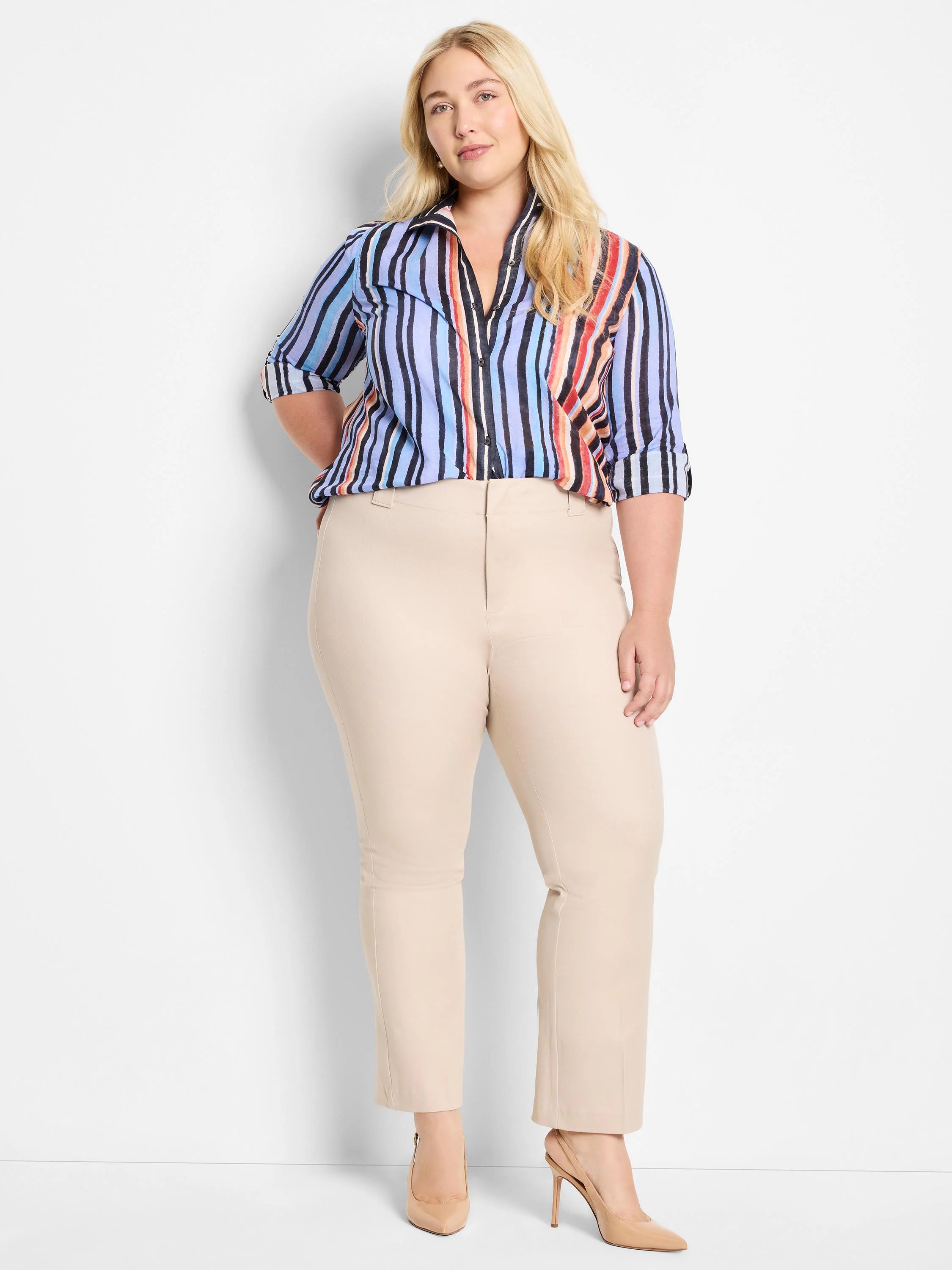 Multicolored vertical stripes on a light blue cotton shirt.  The stripes include black, orange, red, and other muted tones.