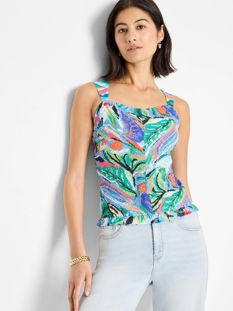 Smocked tank top with blue, green, pink, and orange abstract print.  Square neckline, thin straps, and ruffled hem.