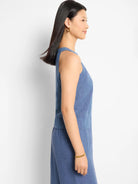 Blue linen sleeveless top, shown in profile view.  Slightly loose fit.