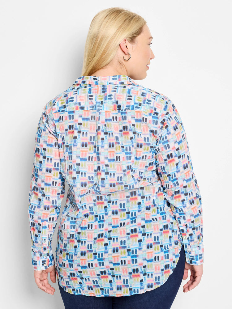 Long-sleeve cotton shirt; pale background with an all-over watercolor print in blues, pinks, and greens.  Buttoned cuffs.