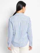 Back view of blue and white vertical striped shirt; long sleeves, collared.