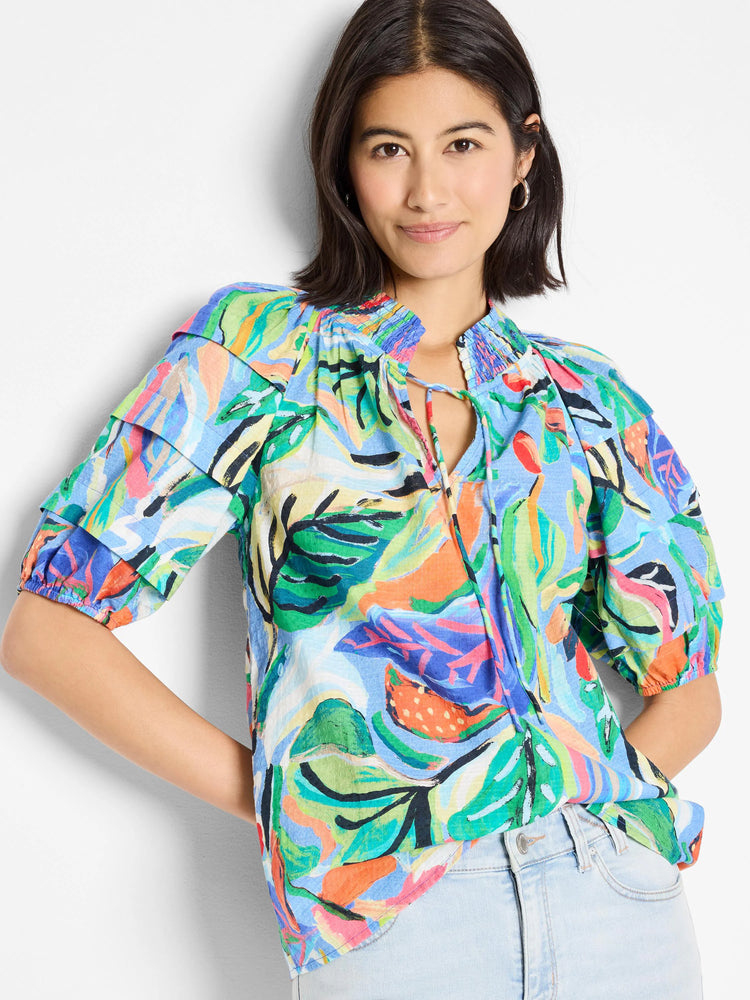 Blue, green, orange, & pink abstract print.  Short sleeves, ruffled shoulders, keyhole neckline with drawstrings.