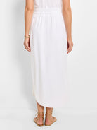 White linen midi skirt with elastic waistband;  slight A-line shape, side slits.