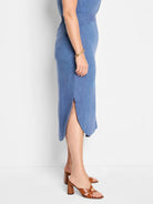Blue linen midi skirt with a side slit.  Relaxed fit.
