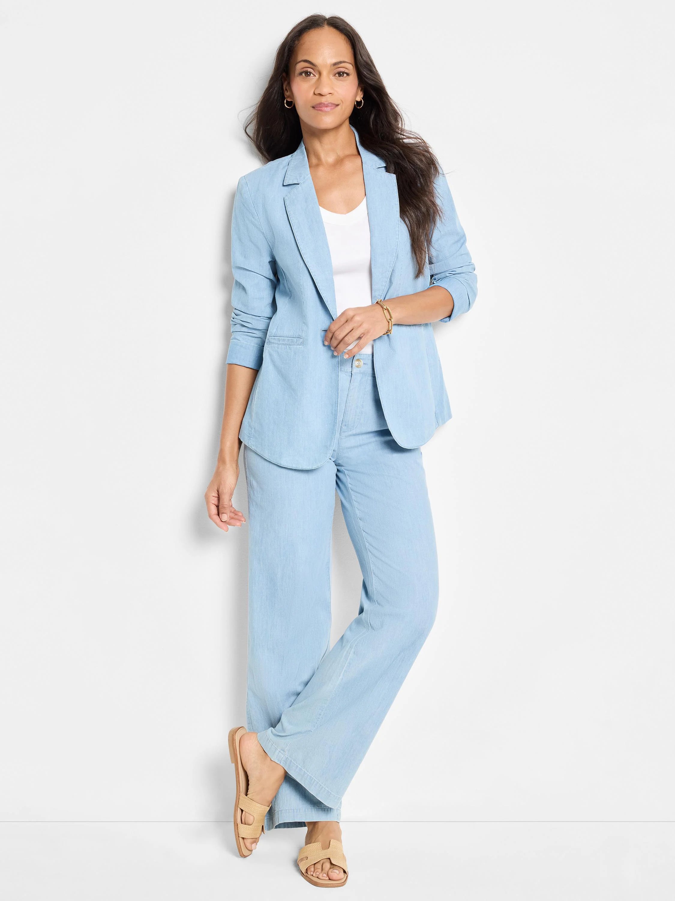 Light blue denim wide-leg pants;  model shown wearing them.