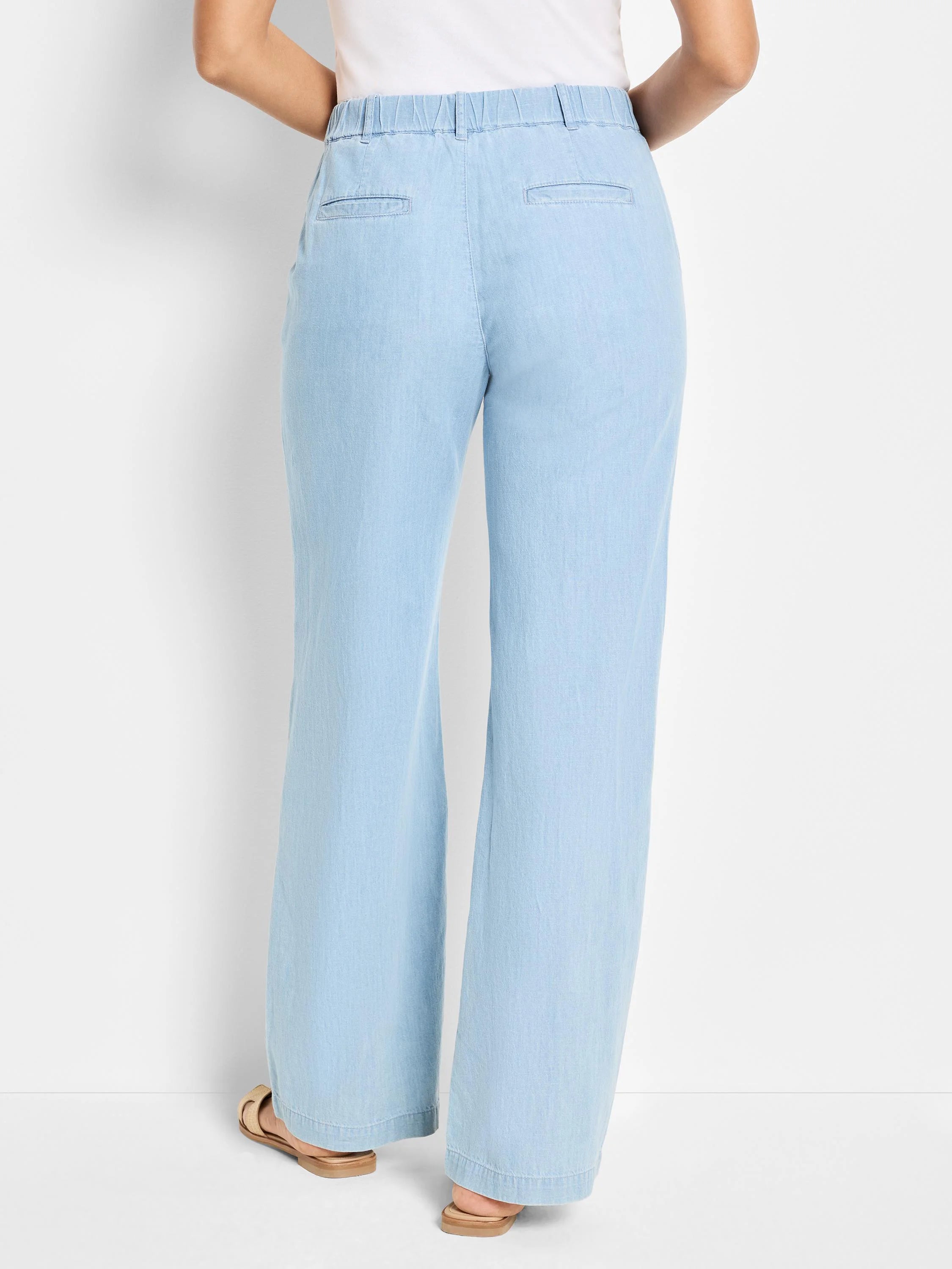 Light blue denim wide-leg pants; elastic waistband; back pockets.