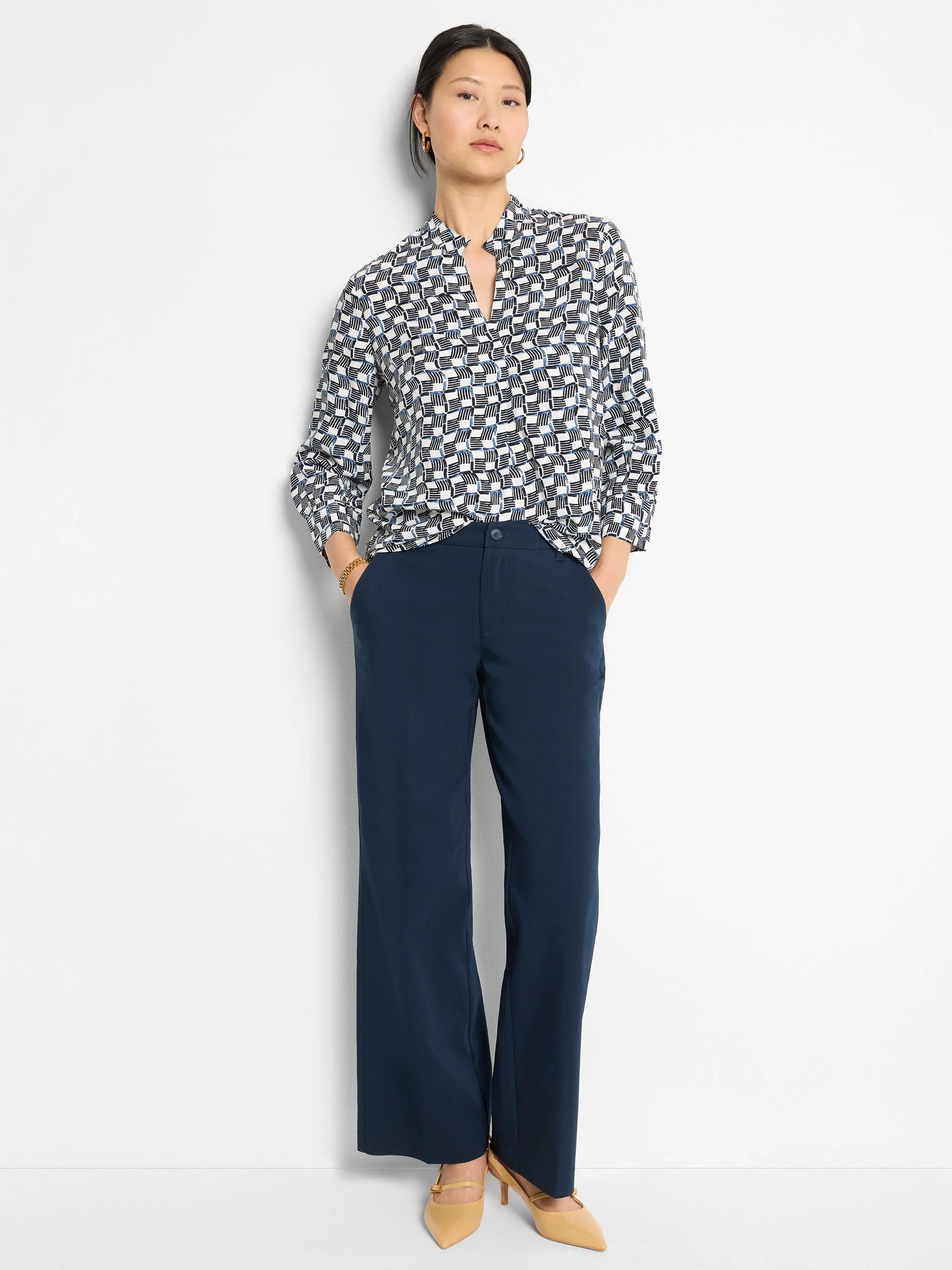 Navy blue wide-leg trousers on a model.