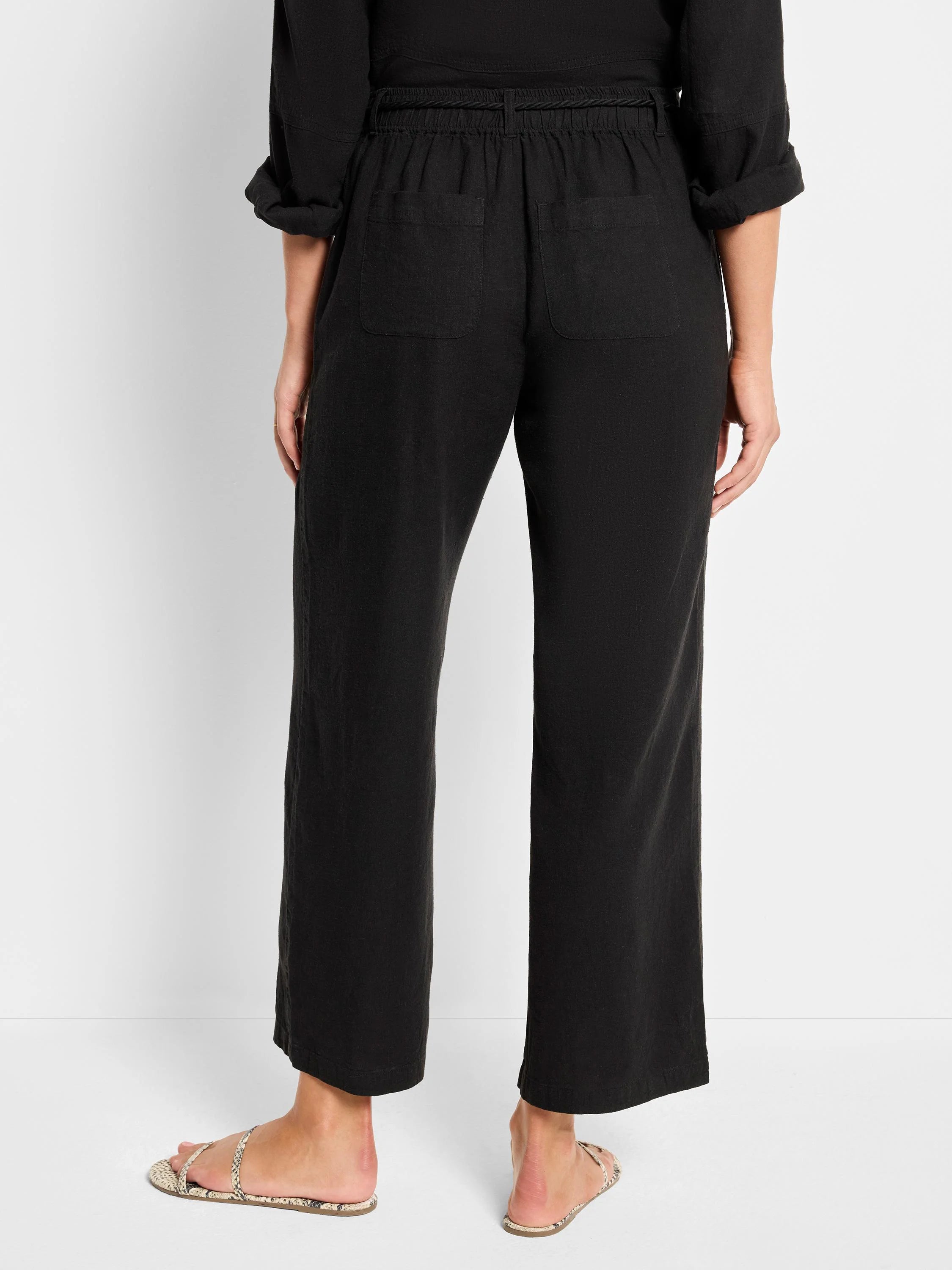 Black linen pants with rope drawstring waist and pockets.  Wide leg.