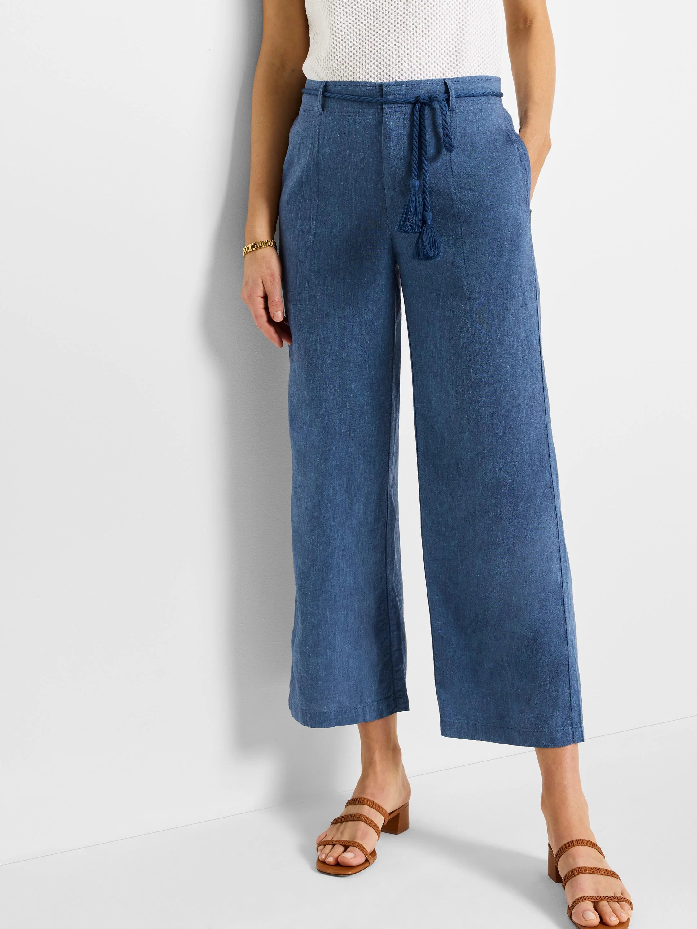 Blue linen wide-leg cropped pants with a matching rope belt and tassels.