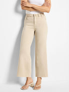 Light tan wide leg jeans with a frayed hem.