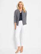 White straight-leg pants;  model wears them with a dark patterned jacket.