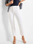 Off-white straight-leg pants on model.  Cropped.