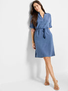 Blue linen dress with short sleeves, V-neck, drawstring waist, and tassels.  Two pockets.