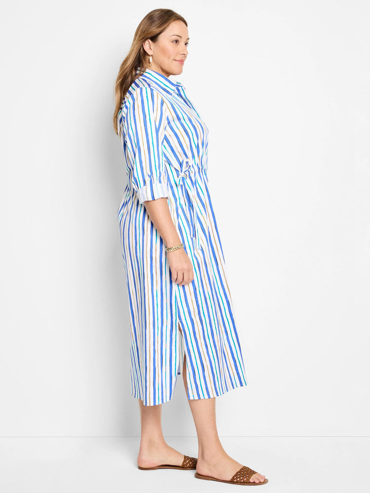 White midi shirt dress with vertical blue, teal, and tan stripes.  Side slits and drawstring waist.
