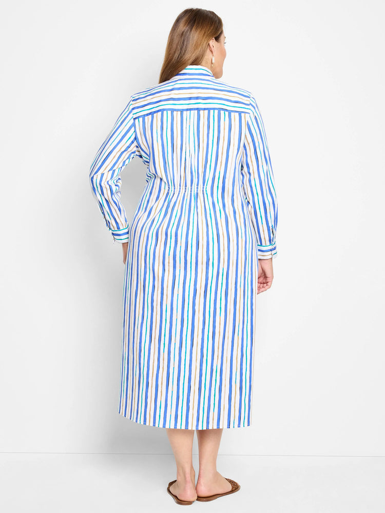 White midi dress with vertical blue, teal, and beige stripes.  Long sleeves, collared shirt neckline, and fitted waist.