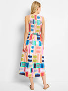 Midi sleeveless dress, multicolored abstract block print in blues, pinks, oranges, and greens.  Back view.