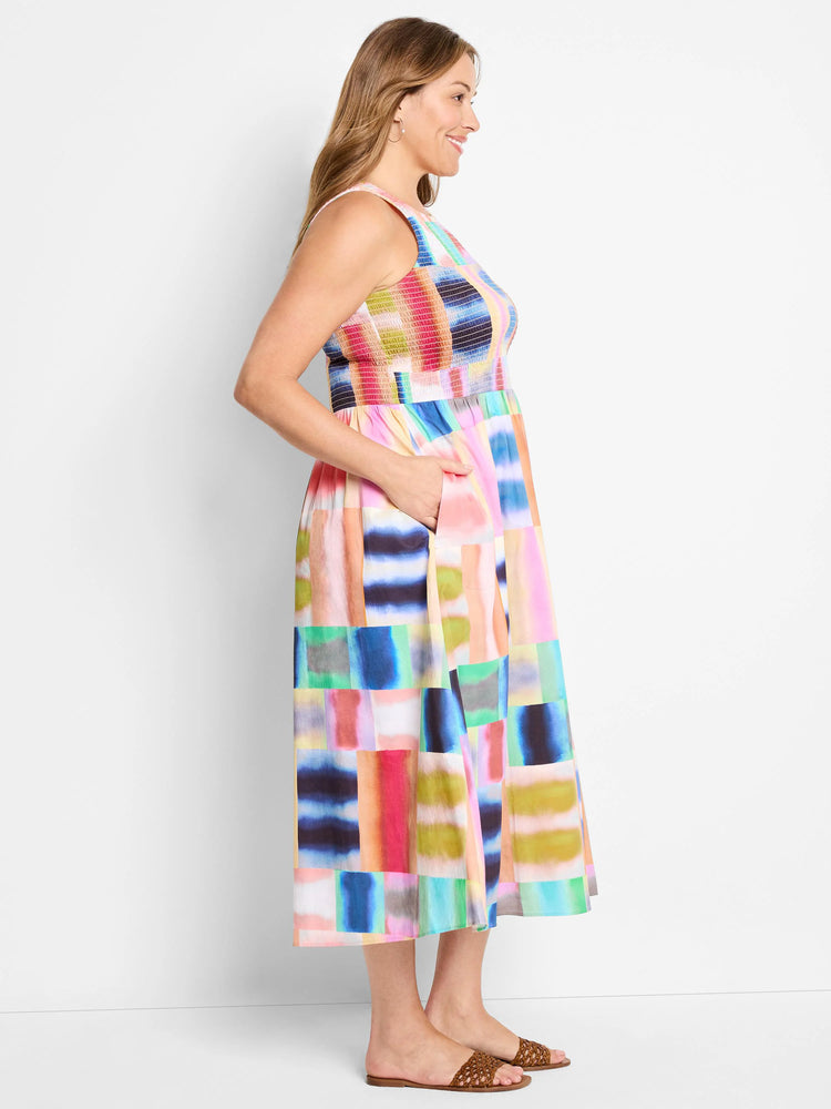 Midi dress, sleeveless,  colorful block print in pinks, blues, greens, and yellows.  Smocked bodice, pockets.