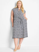 Midi shirt dress, off-white background, black & navy basketweave pattern, short sleeves, belted waist, front slit.